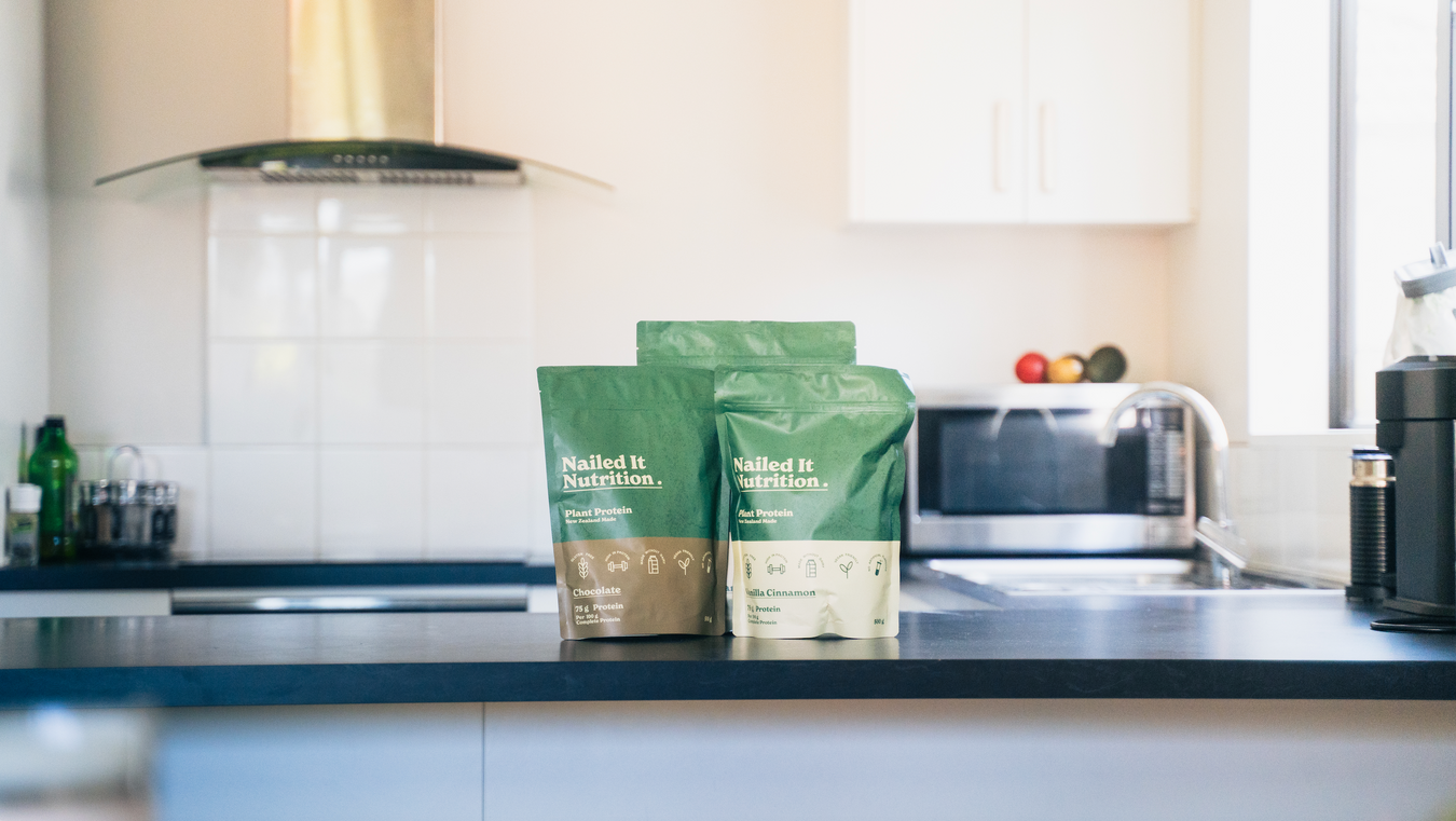 Nailed It Nutrition Plant Based Protein Powder displayed on the kitchen bench.